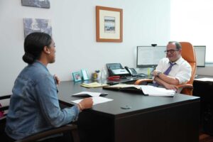 Attorney Phillips conferring with an client about her accident