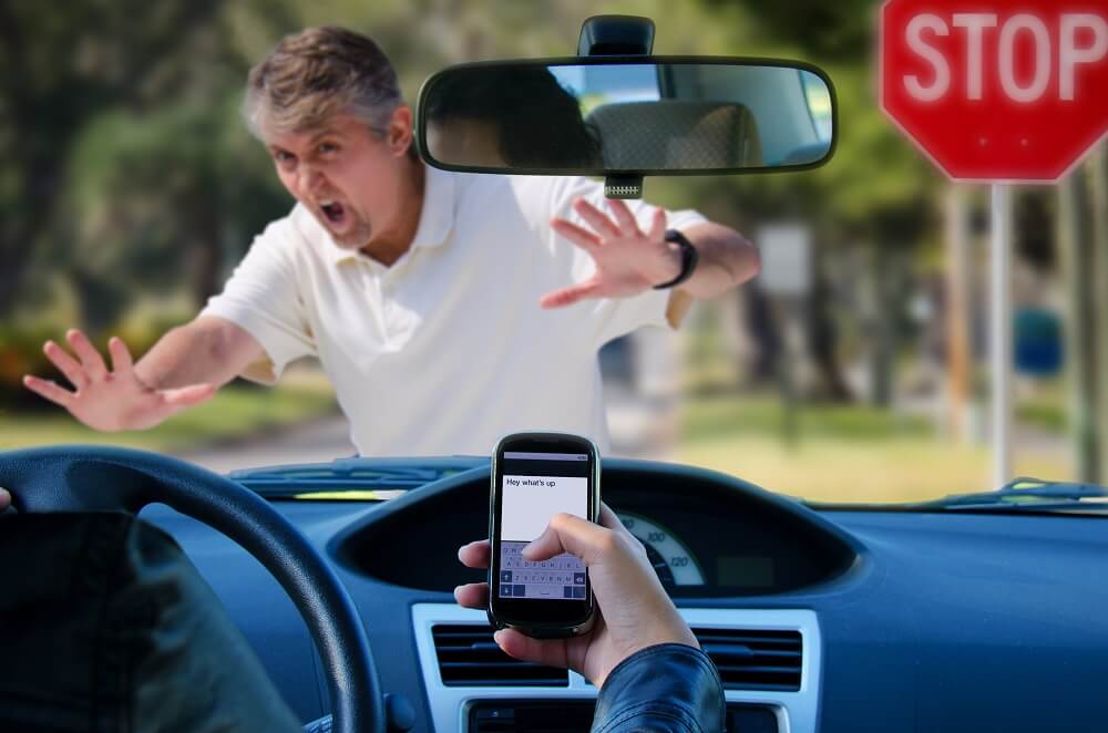 Pedestrian crossing almost got hit by a distracted driver.