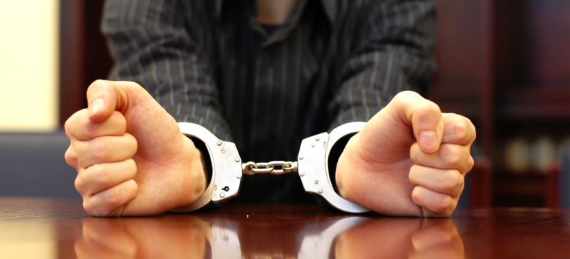 Image of a man in handcuffs