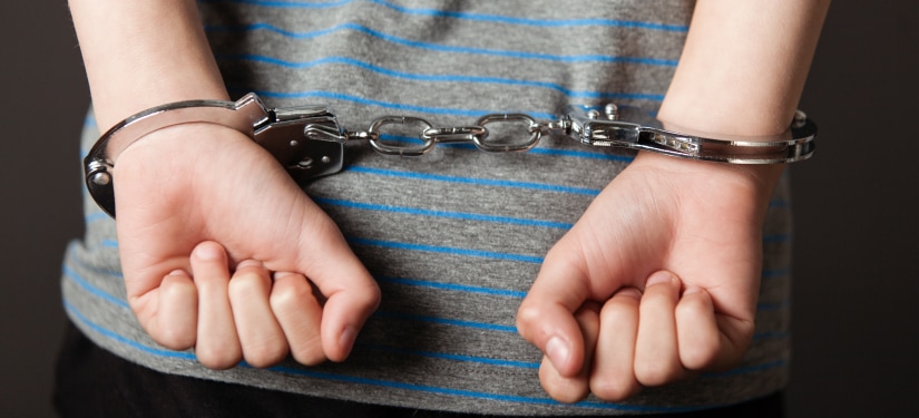 Image of a man in handcuffs